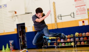 a boy jumping is caught in mid-air