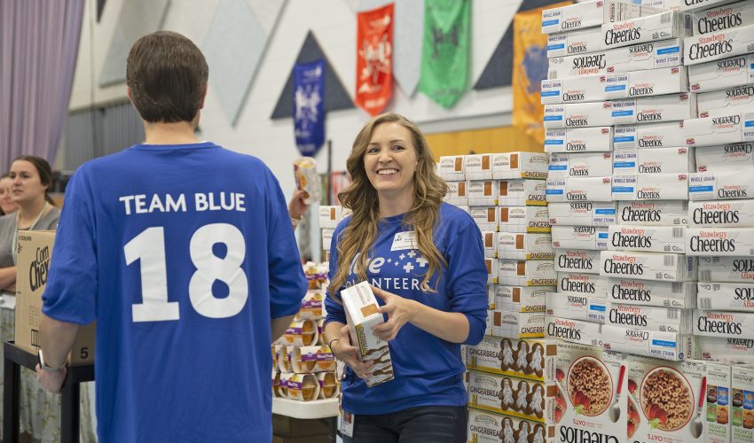 bluecross employee volunteering at chattanooga food bank