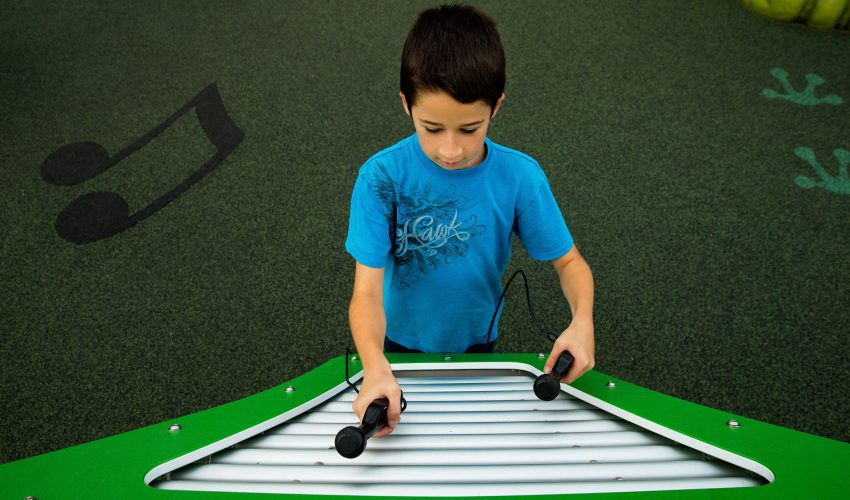 Photo of a boy playing music