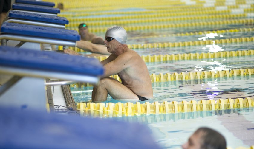 senior olympian gets ready for swim race